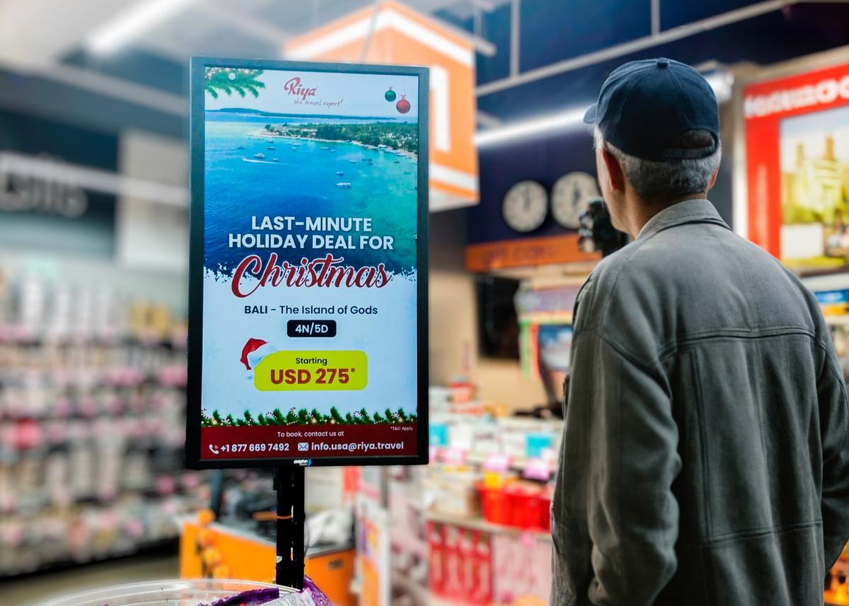 A travel agency promoting holiday deals within a retail store, leveraging retail media networks to reach potential customers with precise, targeted ads